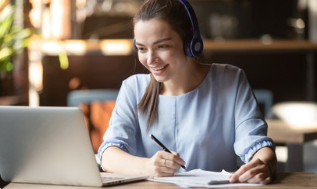 Smiling girl wear wireless headphone study online