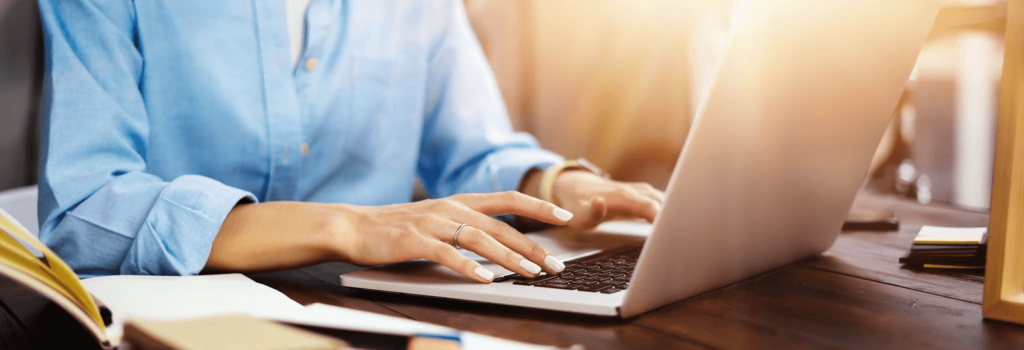 Young beautiful woman working with a laptop