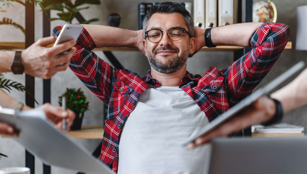 The Burnout Cure-Overcome Overwhelm man looking peaceful with eyes closed as many distractions try to get his attention