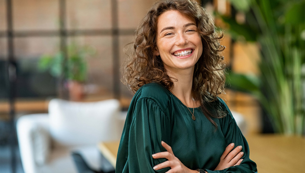 The Burnout Cure-Prevent Emotional Fatigue happy stress free young woman smiling at camera